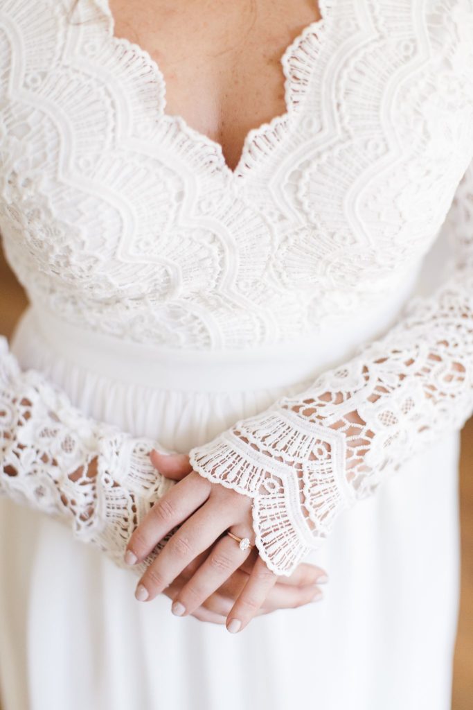 Lace wedding dress and engagement ring