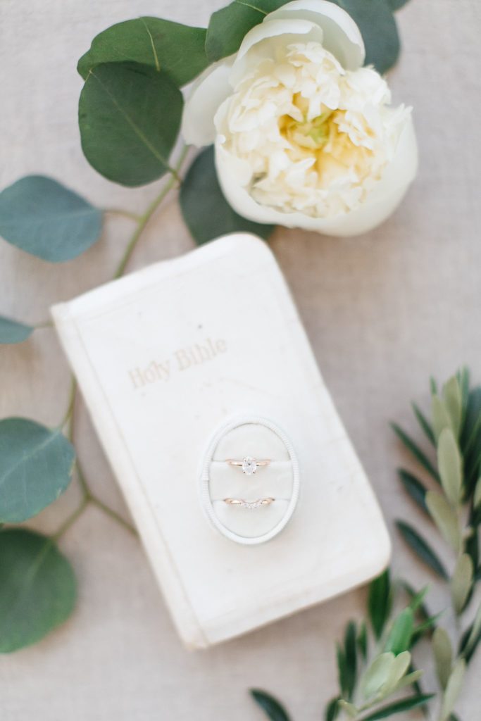 Wedding rings in elegant ring box with family wedding bible
