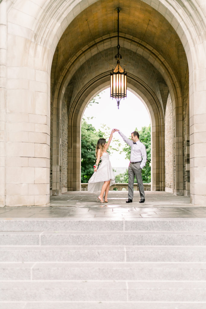 Couple dancing under stone archway