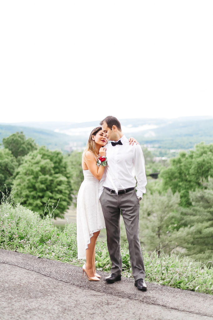 Couple kissing on a scenic lookout over the Finger Lakes