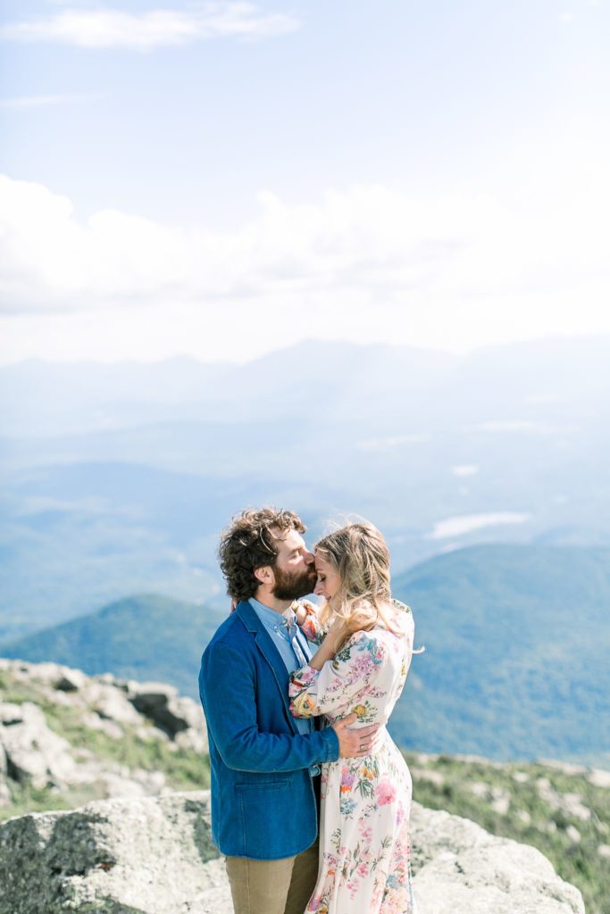 Adirondack wedding photographer, couple kissing atop Whiteface Mountain