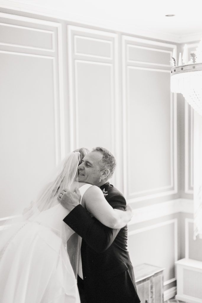 A father at Genesee Valley Club, seeing his daughter in her wedding gown for the first time