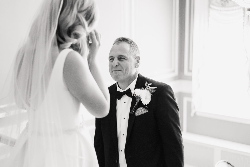 A father at Genesee Valley Club, seeing his daughter in her wedding gown for the first time