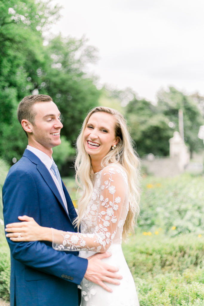 Bride and groom laughing in Sonnenberg Gardens wedding photos