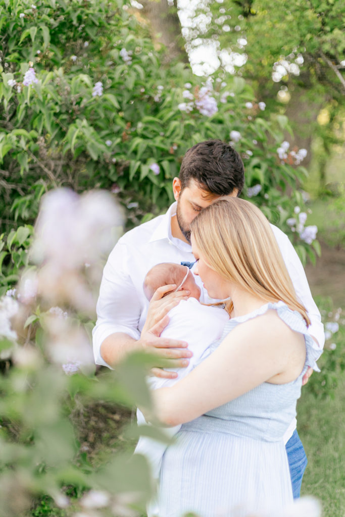 A family portrait from a newborn photography session in Rochester NY's Highland Park.