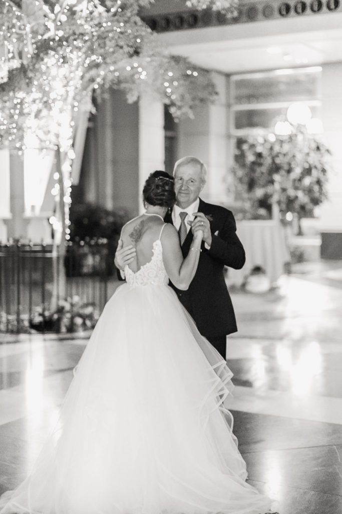 A bride and her father dancing at a Wintergarden wedding in downtown Rochester, NY.