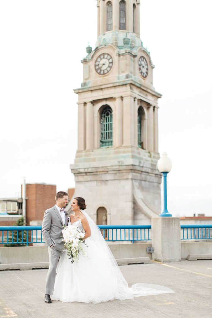 Portrait of a wedding couple on a Rochester rooftop after their Wintergarden wedding.